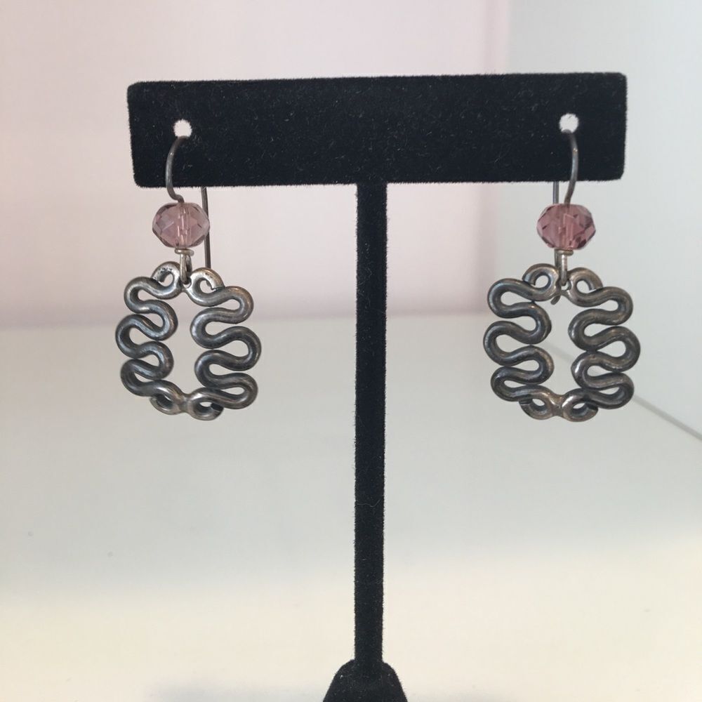 Handmade earrings with a purple crystal bead